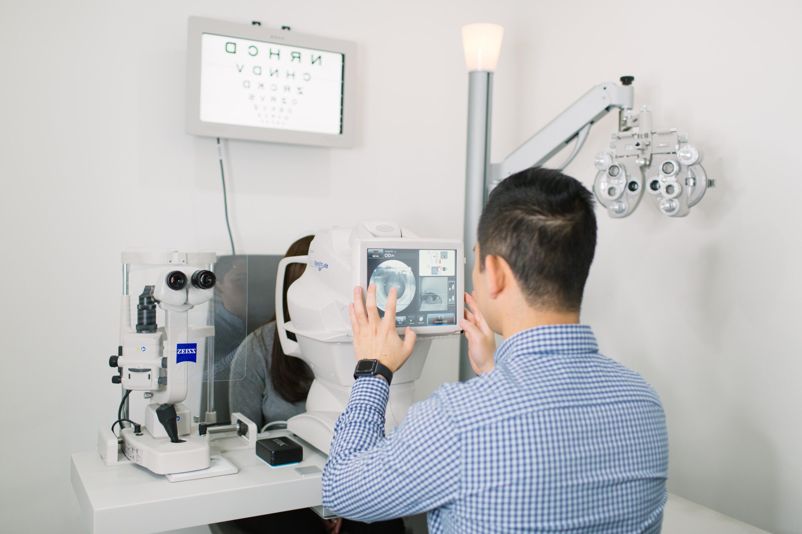 An optometrist doing a scan on a patient