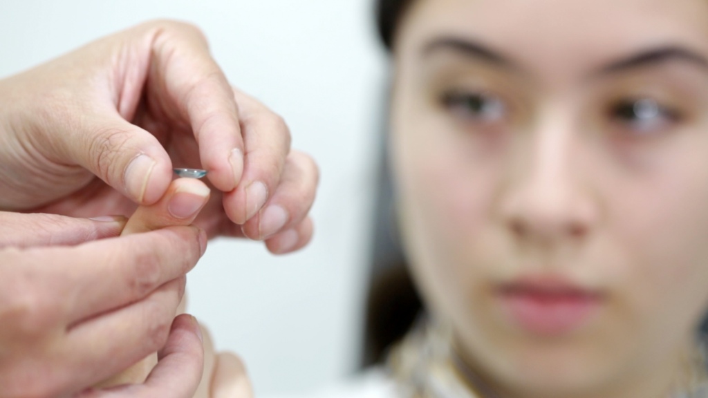 placing an Orthok lens on a patient finger tip